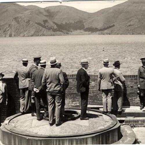 [Crowd examines view of Marin hills prior to construction of Golden Gate Bridge]