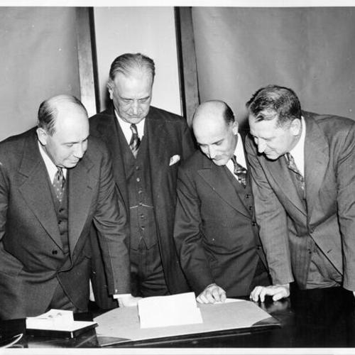 [Donald Richberg, A. P. Giannini, L. M. Giannini and William Stanley]