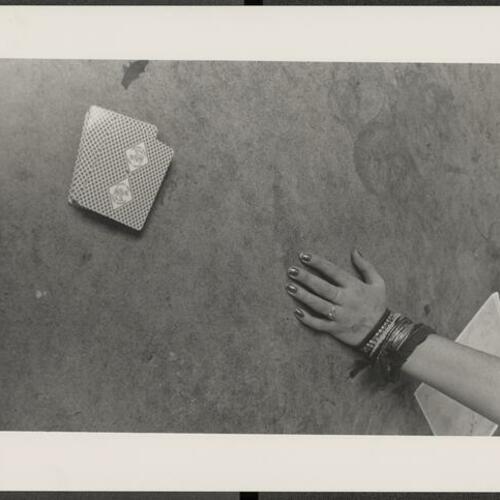 Person's arm and deck of cards at Larkin Youth Center