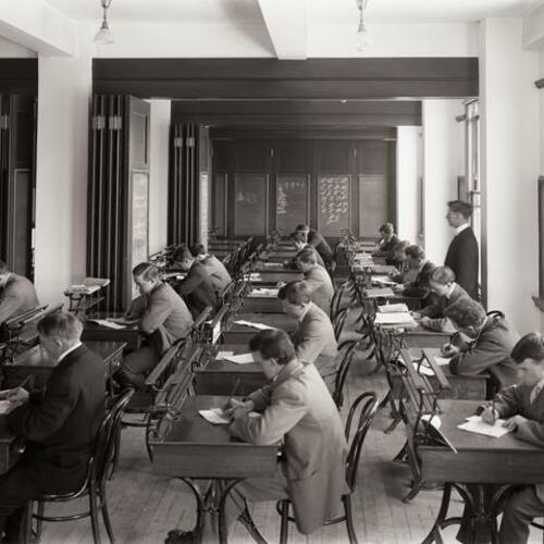 Y. M. C. A. classroom with people sitting at desks