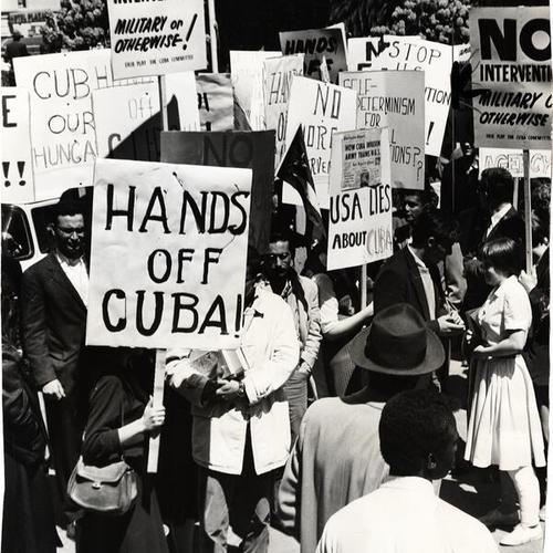 [Demonstrators in Union Square carrying banners supporting Fidel Castro and protesting the invasion of the island]