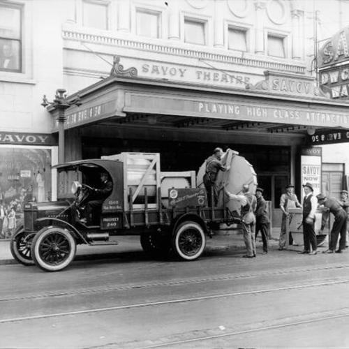 [Men unloading a truck outside the Savoy Theatre (later renamed the President, then the Royal)]