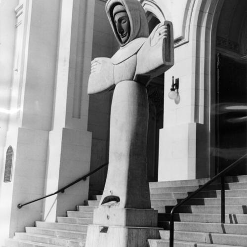 [Statue of Saint Francis of Assisi at the entrance to St. Francis of Assisi Church]