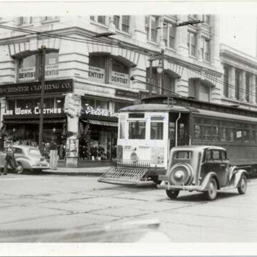 [Mission and Third streets looking southwest at inbound #14 line car 1553 passing in front of Rochester Clothing Company]