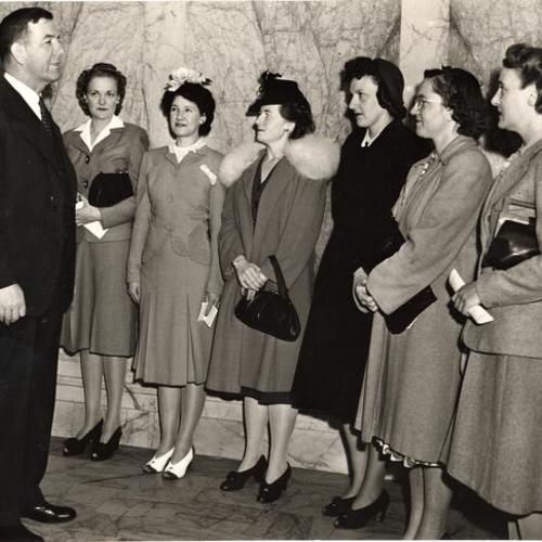 [Amy A. Sliger, Vera C. Wendt, Mary M. O'Malley, Elizabeth M. Rickey, Rita Bernell and Florence M. Moodie with Chief Dullea after taking their oath as police officers at San Francisco Police Department]