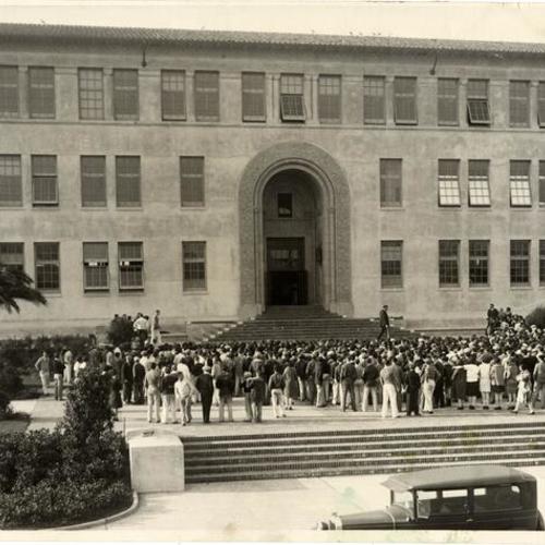 Balboa High School students crowding around the front steps of the school]