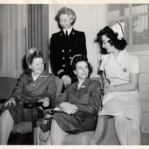 [Cadet Nurses Josephine Sweeney, Sarah Rutherford and Yvonne Buddi, chatting with one of their instructors, Lt. Eunice Wilhite]
