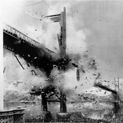 [Fake Golden Gate Bridge being blown up for a movie about a hypothetical World War III]