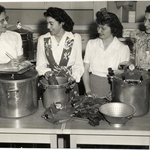 [Home Economics Instructor Frances Mount talking to three students at San Francisco Junior College]
