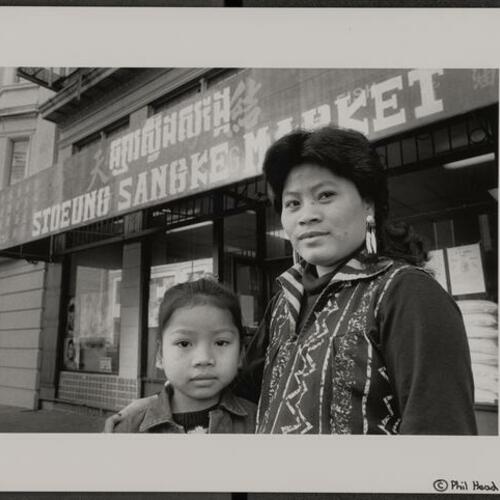 Cambodian refugee grocery store owner Lany Wong outside of her new store