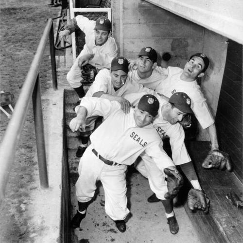 [Six San Francisco Seals players fooling around in the dugout]