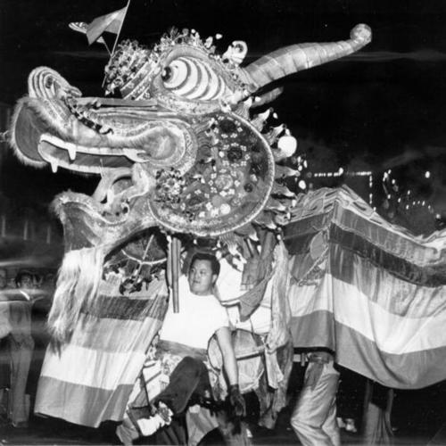 [Lion dancing in Chinese New Years parade]