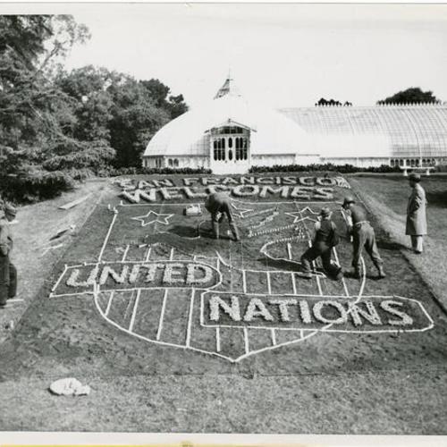 [Gardeners preparing a floral display welcoming the United Nations to San Francisco outside the Conservatory of Flowers in Golden Gate Park]