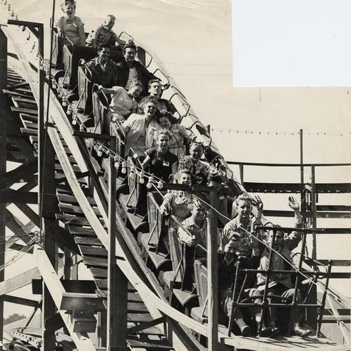 [People riding the roller coaster at Playland at the Beach]