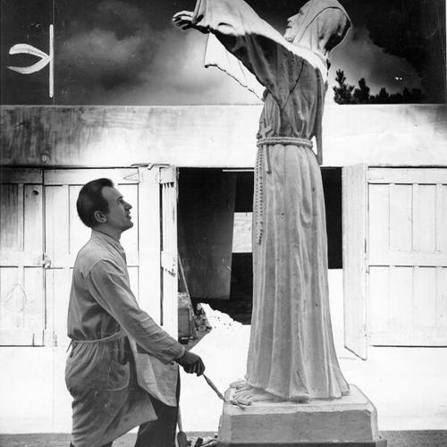 [Sculptor Ettore de Zoro with a scale model of a statue of Saint Francis of Assisi]