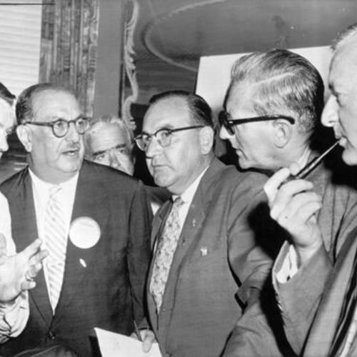 [Attorney General Edmund G. ("Pat") Brown and other California delegates meet at a state caucus]