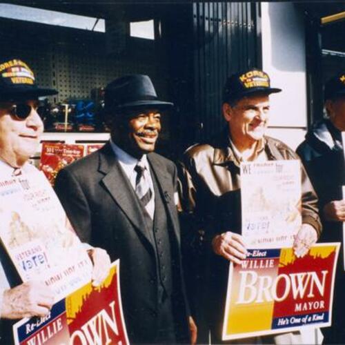 [Korean War Veterans posing with Willie Brown during his re-election campaign]