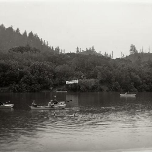 People boating in water at Camp McCoy