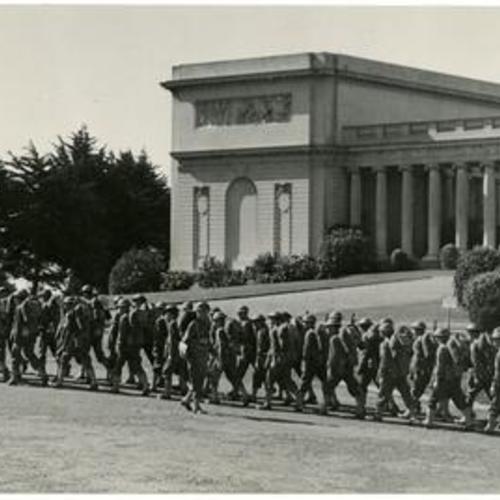 [Thirtieth Infantry troops marching past the Palace of the Legion of Honor]