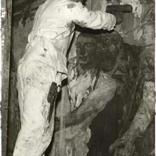 [Percy McNulty mounting one of eight murals in the opera house]