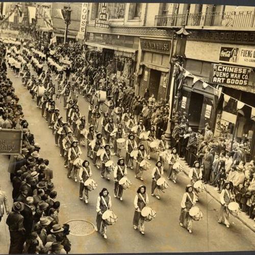 [Drum corps marching in a Chinatown parade in honor of Madame Chiang Kai-Shek]