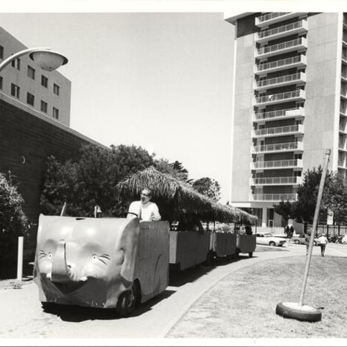 [People riding in an "Elephant Train" at San Francisco State College]