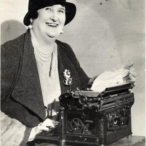 [Kate Sullivan at the typewriter]