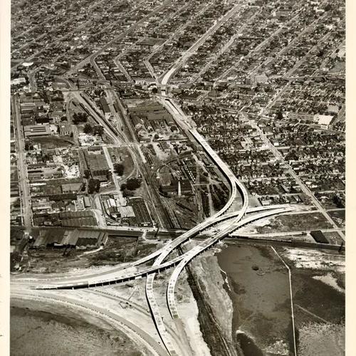 [Aerial view of Oakland approaches to Bay Bridge under construction]
