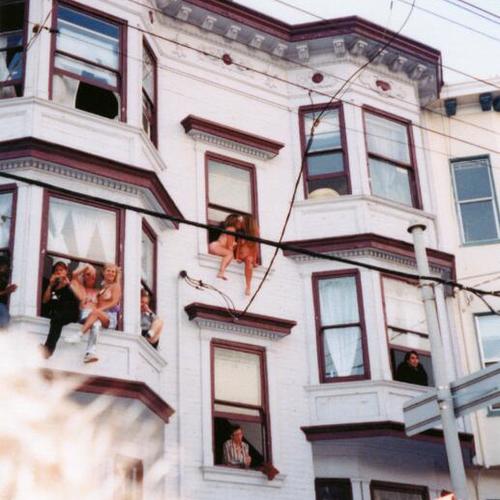 [Nude women hanging out of windows in support of Dyke March in 2001 on 16th Street]