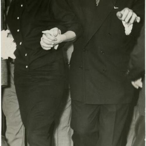 [Marilyn Monroe and Joe Di Maggio at City Hall immediately after getting married]