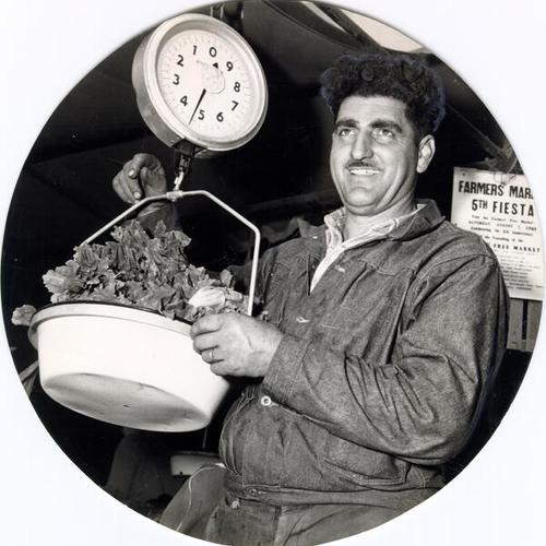 [Tony Masini weighing vegetables at the Farmers' Market on Alemany Boulevard]