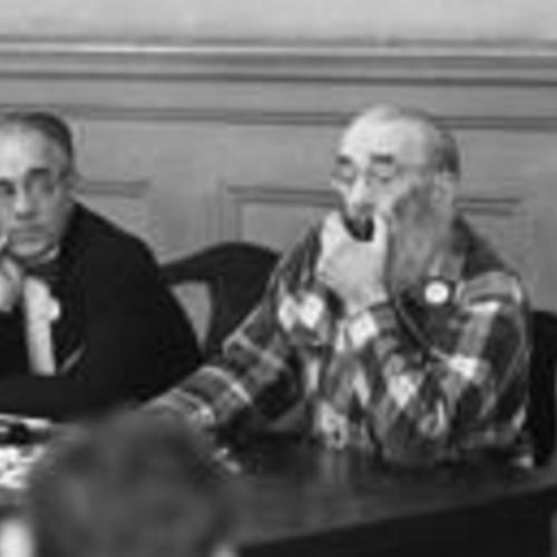 [George Woolf (right) on panel at a meeting of Tenants and Owners in Opposition to Redevelopment (TOOR) at Milner Hotel,