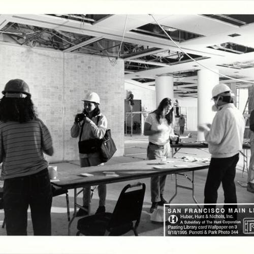 [Construction of artists Ann Hamilton and Ann Chamberlain's art project involving the pasting old catalog cards on walls in new Main Library]
