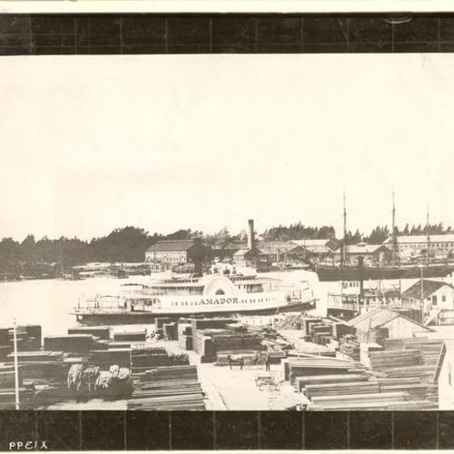[View of ferryboat "Amador" docked along side a lumber yard]