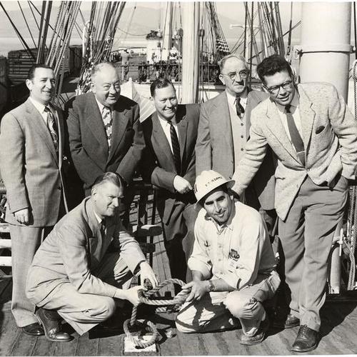 [Volunteer workers and officials of the Maritime Museum posing on the deck of the sailing ship "Balclutha" after completion of restoration work on the historic vessel]