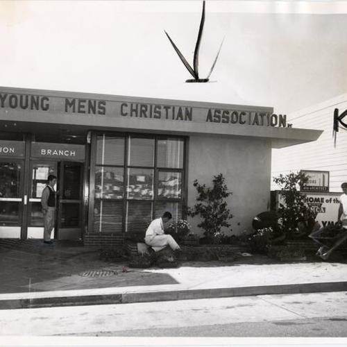 [Students from Balboa High School setting out plants in front of the Y.M.C.A. Mission Branch]