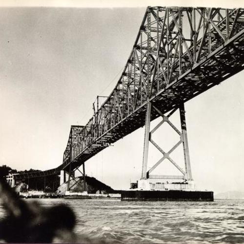 [View from below of San Francisco-Oakland Bay Bridge cantilever section under construction]