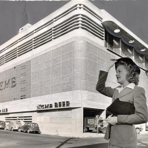 [Lucille Knutson standing in front of the Acme Brewery at Buchanan and Grove streets]