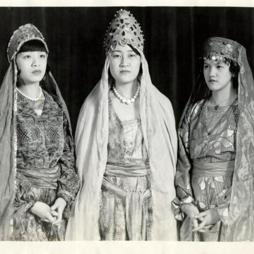 [Lily Lum, Lucy Tom and Mary Chung dressed for their roles in the opera "Queen Esther"]