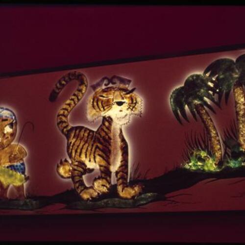 Sambo's Restaurant mascot and tiger art hanging on wall