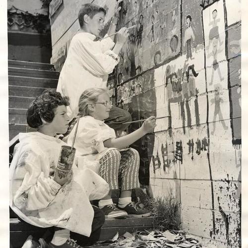 [Children painting on wall at Camp Tiyatah, a six-week summer home camp at Jewish Community Center]
