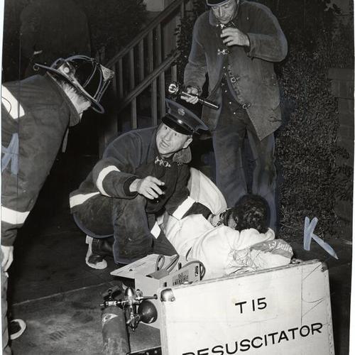 [Firemen from Truck Company No. 15 resuscitating Mary G. O'Hern after a fire broke out in her home]