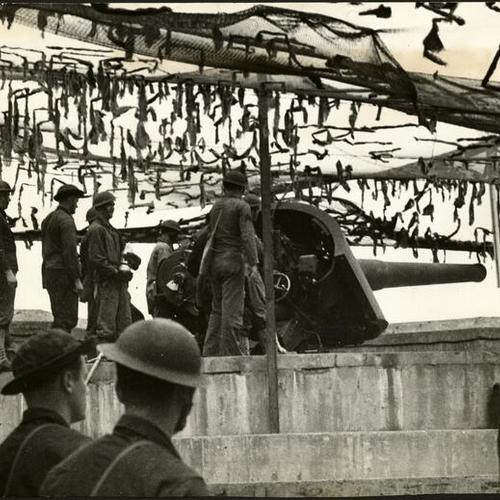 [Artillerymen standing ready during a war games exercise at the Presidio]