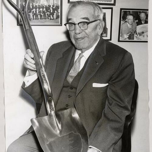 William L. Hughson holding golden shovel