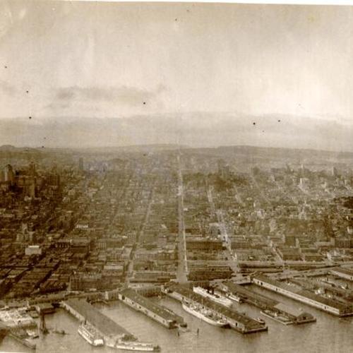 [Aerial view of the city and the waterfront]