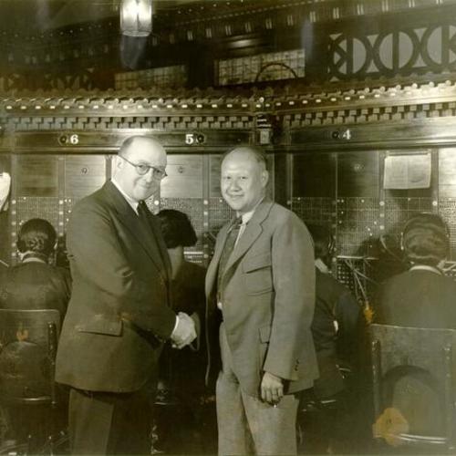 [Lyle M. Brown and Kern Loo inside the Chinese Telephone Exchange in San Francisco]