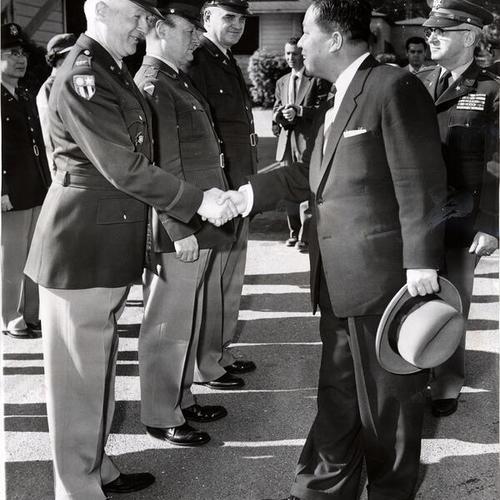[Colonel H. A. Davenport greeting Mr. Kim Yong Woo, Korean Minister of National Defense, at the Presidio of San Francisco]