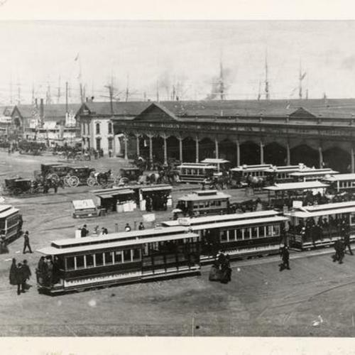 [Cable cars and horse cars in front of the Ferry Building]
