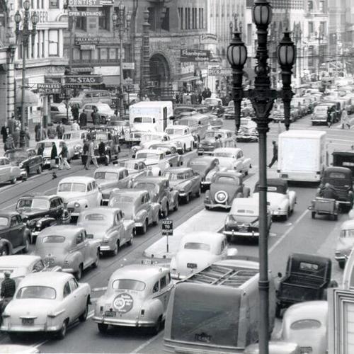 [Cars parked down the middle of Market Street during a Muni Railway strike]