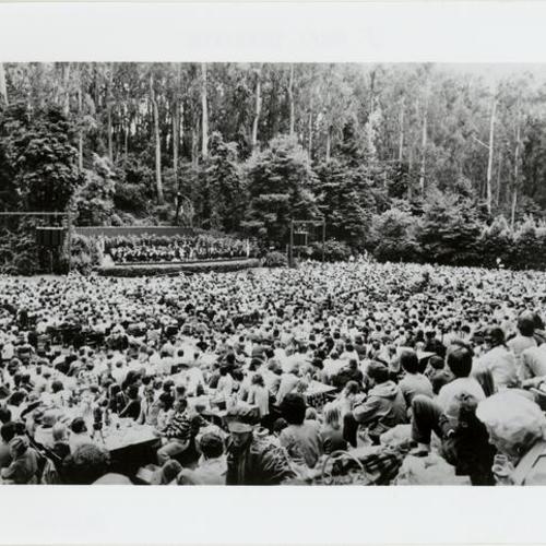 [Crowd listening to concert in Stern Grove]